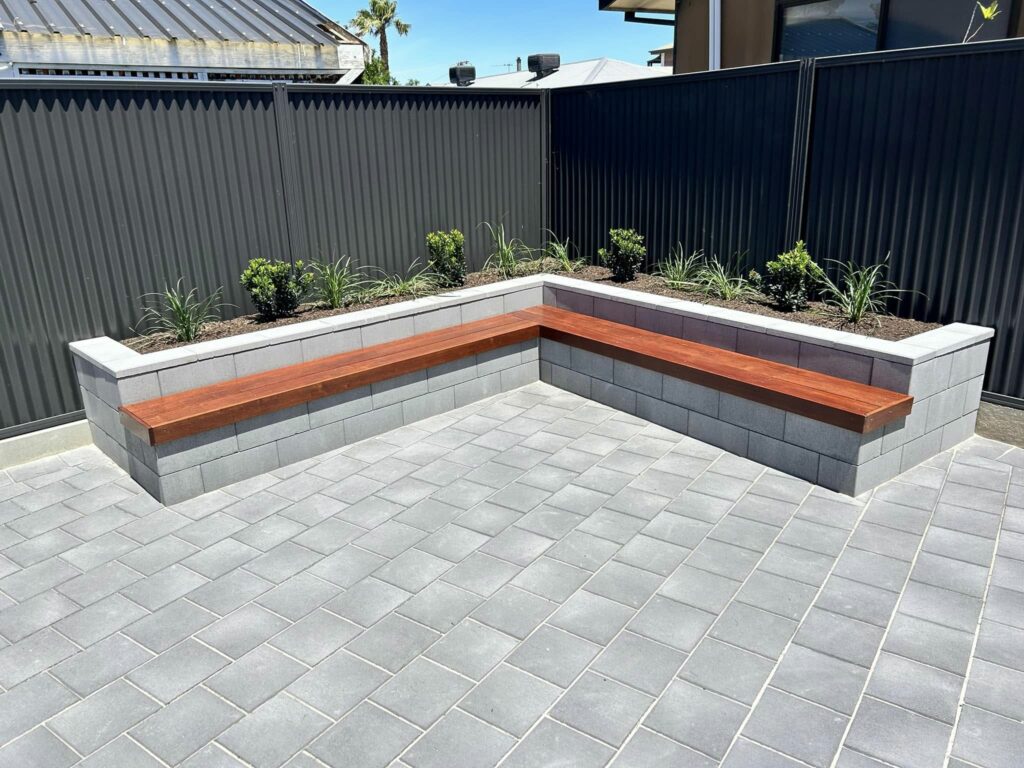 Flagpave Pavers Charcoal | Versasmooth Retaining Wall Block seating | Rosewall Landscaping