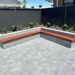 Flagpave Pavers Charcoal | Versasmooth Retaining Wall Block seating | Rosewall Landscaping