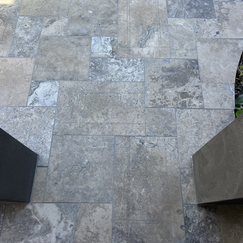 12mm Silver Travertine French Pattern tiles entrance porch | Hourigan Landscaping