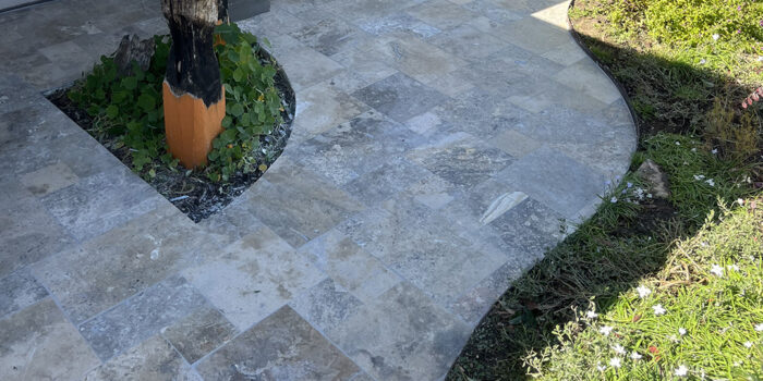 12mm Silver Travertine French Pattern tiles front porch | Hourigan Landscaping