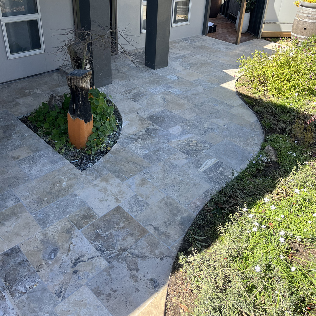 12mm Silver Travertine French Pattern tiles front porch | Hourigan Landscaping