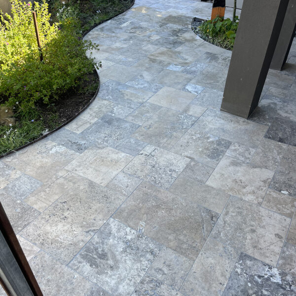 12mm Oyster Travertine French pattern tiles entrance | Hourigan Landscaping