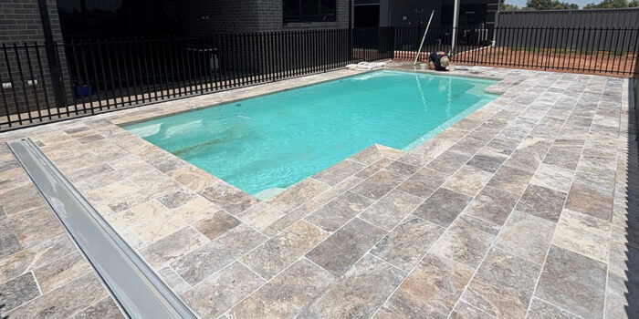 30mm Silver Travertine with drop face Pool Paving | MTK Carpentry Construction.jpeg